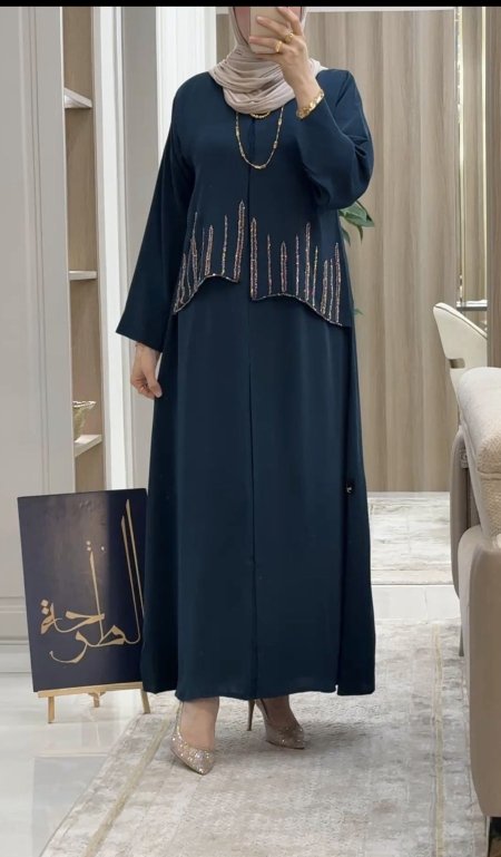 عبايه ترقواز مع شك ذهبي